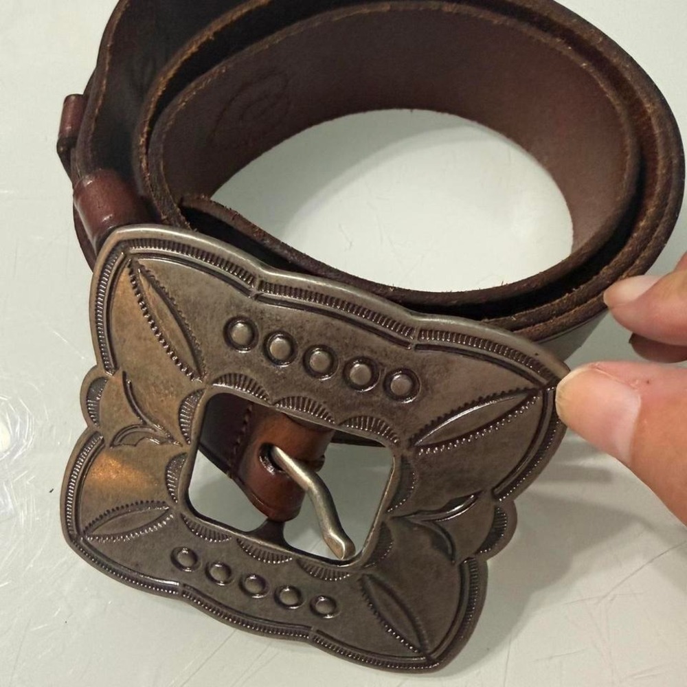 Vintage from estate. Brown leather belt with silver buckle